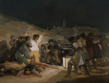 1808年5月3日。右の兵士たちが銃を構え、左の白いシャツの男性が両腕を上げ、中央の灯火が両者を照らす。